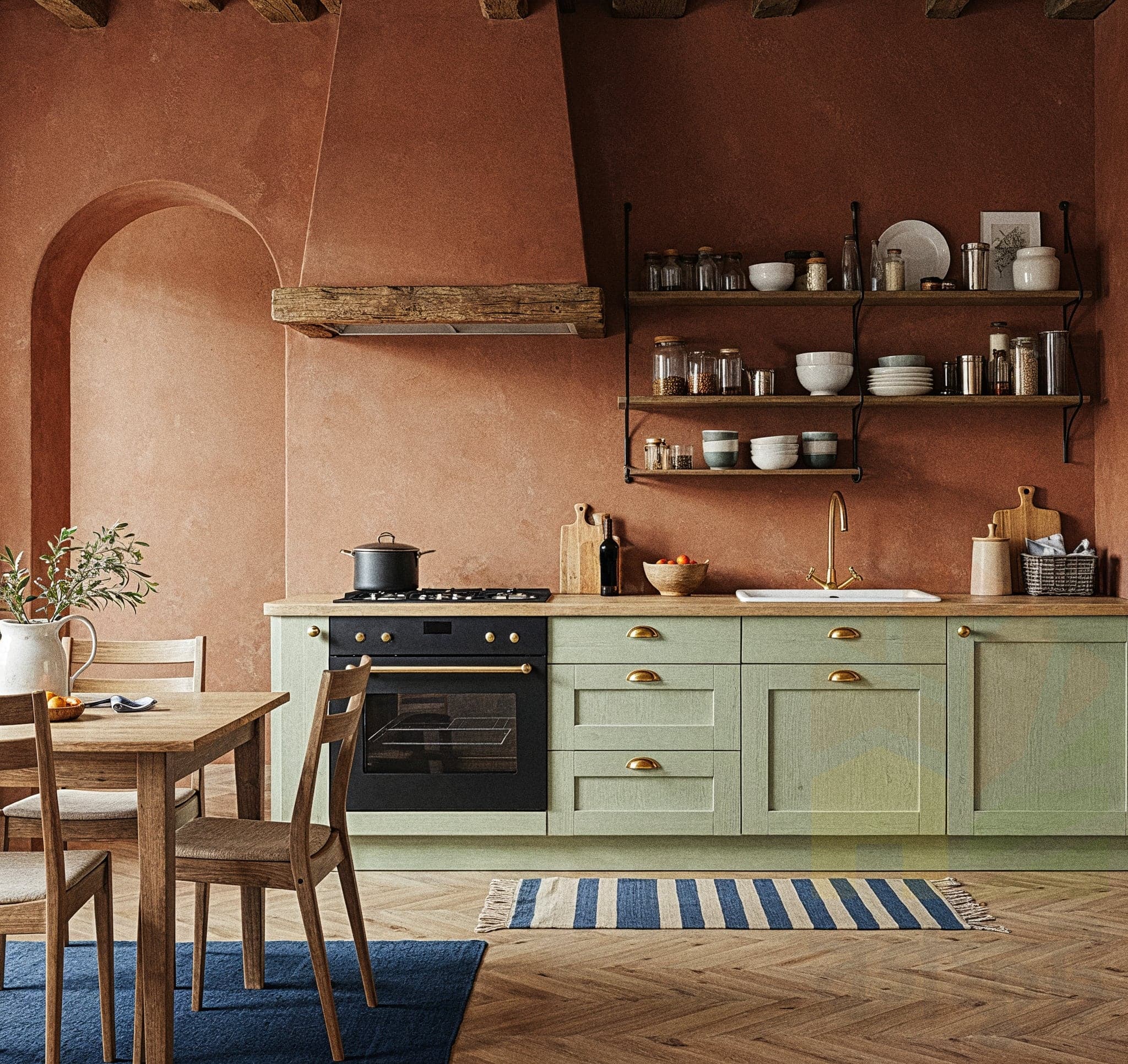 A cozy kitchen with a Rustic Warm design, featuring wooden cabinets with open shelves displaying ceramic bowls and spices, a stone backsplash, and a wooden countertop with a kettle. The room includes a vintage sink with brass faucet, a hanging rack with copper pots, and warm pendant lights with Edison bulbs. Large windows with sheer curtains allow natural light to enhance the dark wooden floor and beige walls, creating a welcoming cooking atmosphere.